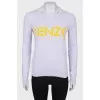 Lavender sweatshirt with a brand logo