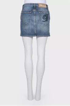 Denim skirt with back appliqué