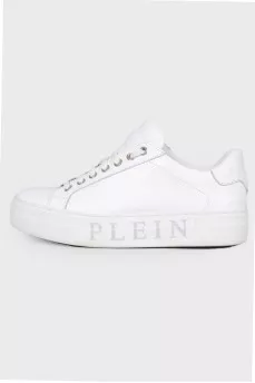 Sneakers with a print of a logo on the sole