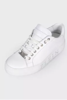 Sneakers with a print of a logo on the sole