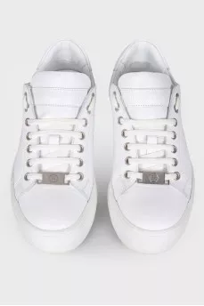 Sneakers with a print of a logo on the sole