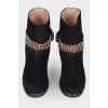 Leather boots with a gold chain