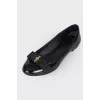 Lacquered ballerinas with a bow