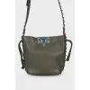 Green studded bag with tag