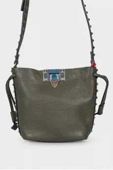 Green studded bag with tag