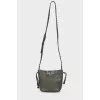 Green studded bag with tag