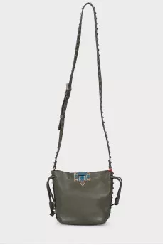 Green studded bag with tag