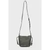 Green studded bag with tag