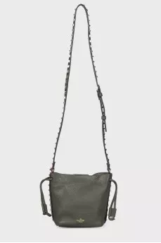Green studded bag with tag