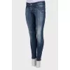 Jeans with decorative scuffs