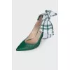 Green shoes with a checkered bow