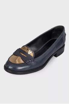 Loofers with a golden metal toe