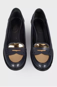Loofers with a golden metal toe