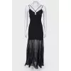 Black floor-length dress with a tag