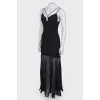 Black floor-length dress with a tag