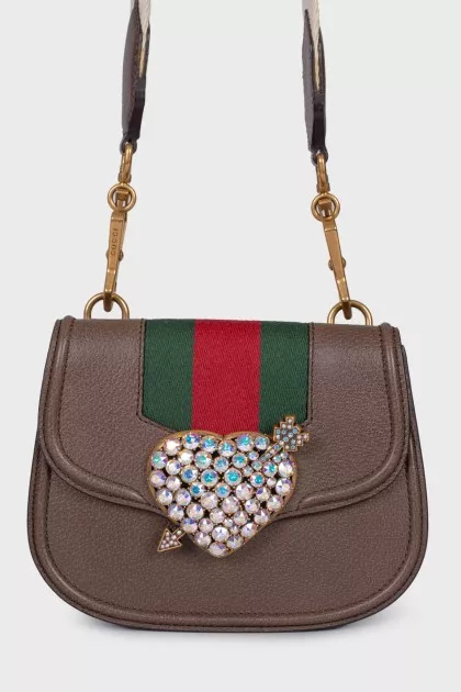 Bag with appliqué and wide strap