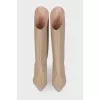 Pointed heel leather boots with tag