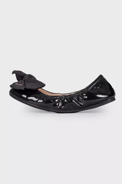 Black patent ballerinas with a large bow