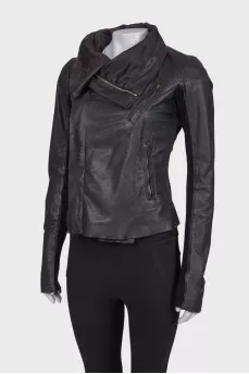 Leather jacket with knitwear on sleeves