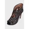 Shoes with a cut -out pattern and rivets