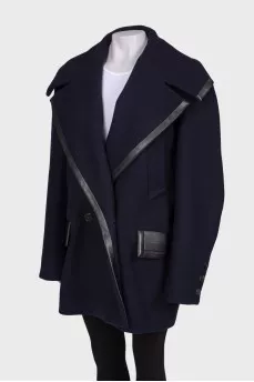 Blue coat with leather inserts