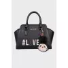 Leather bag with keychain and branded patch