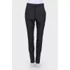 Black trousers with stripes