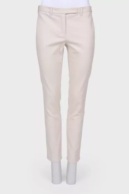 Compressed beige pants with arrows