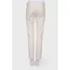 Compressed beige pants with arrows