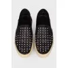 Black slip-on shoes with spikes