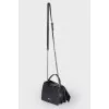 Bag with leather bow