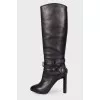 Black high boots on heels