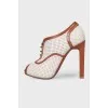 Perforated peep toecap ankle boots