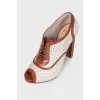 Perforated peep toecap ankle boots