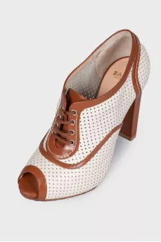 Perforated peep toecap ankle boots