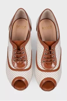 Perforated peep toecap ankle boots