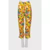 Yellow trousers with a floral print with label