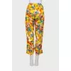 Yellow trousers with a floral print with label