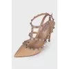 Beige studded pumps