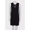 Black dress with a translucent insert on the chest