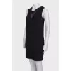 Black dress with a translucent insert on the chest