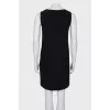 Black dress with a translucent insert on the chest