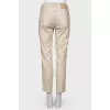 Beige trousers with stripes