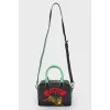 Leather bag with appliqué