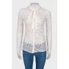 Lace blouse with slogan on the back
