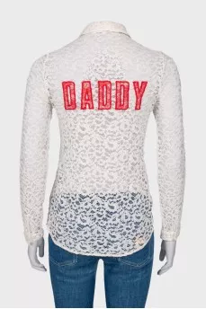 Lace blouse with slogan on the back