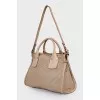 Beige perforated bag
