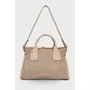 Beige perforated bag