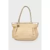 Wicker bag with leather handles