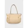 Wicker bag with leather handles